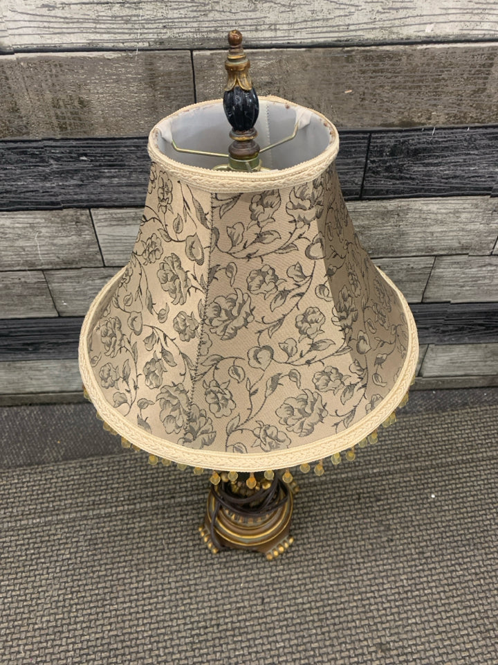 BLACK MARBLE ORNATE LAMP WITH TAN FLORAL SHADE W/ BEADS.