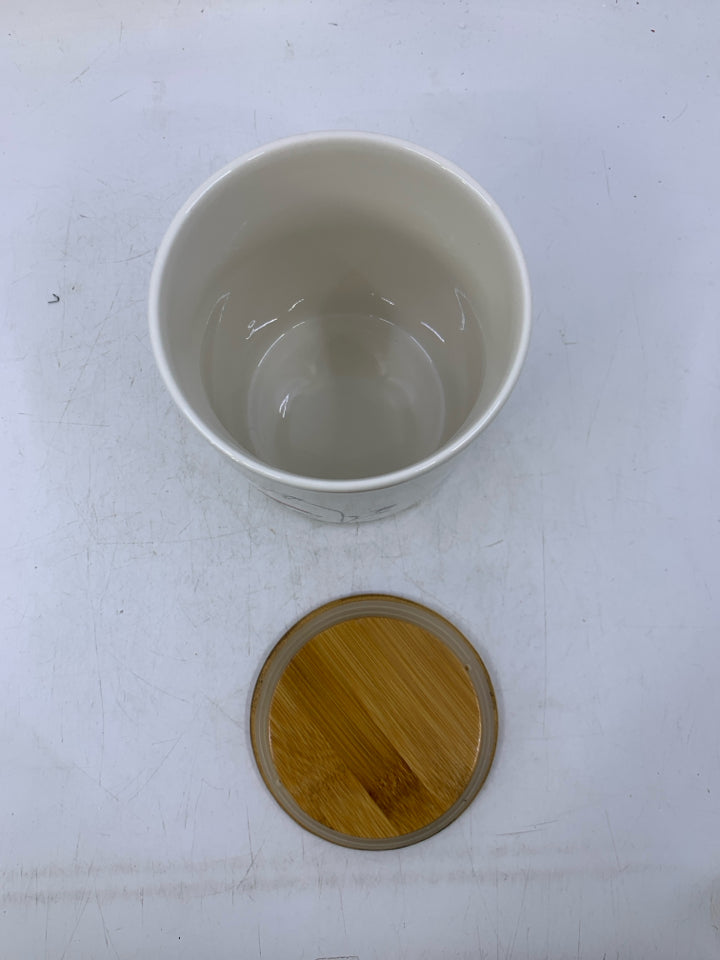 ILLUSTRATION OF BIRD W/ RED HAT OH JOY HANGING FROM TREE.