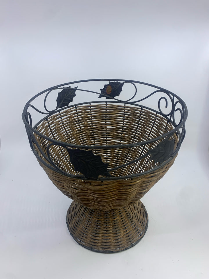 METAL SCROLL AND WICKER PLANTER BASKET W/LEAF DETAILS.
