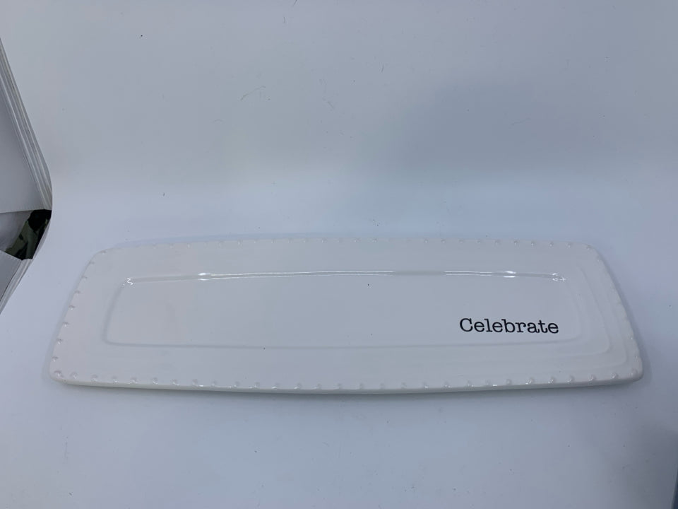 LONG WHITE RECTANGLE TRAY W/ CELEBRATE CARVED INTO.