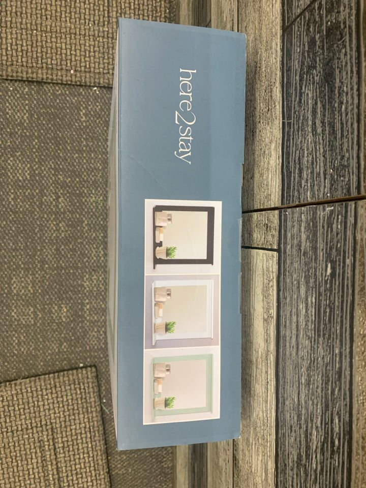 NIB WALL SHELF WITH MIRROR.