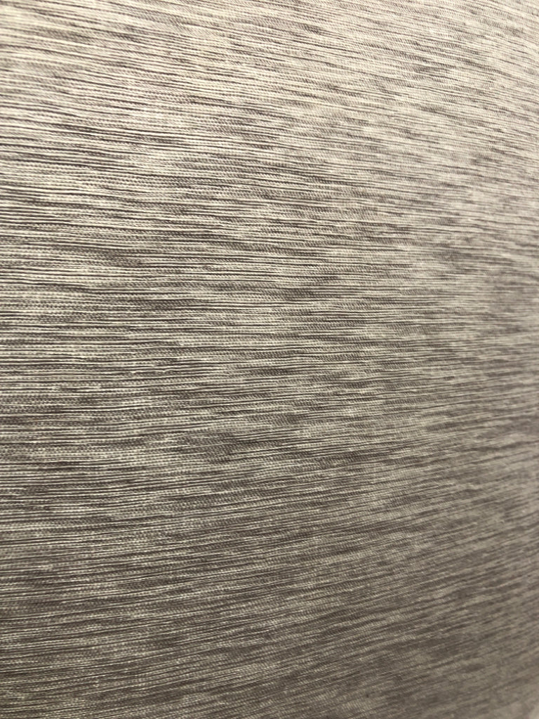 LIGHT BROWN FABRIC PILLOW.