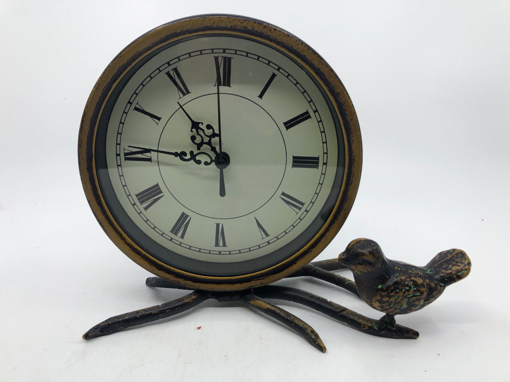 DISTRESSED METAL CIRCLE CLOCK W/ BIRD ON BRANCH.