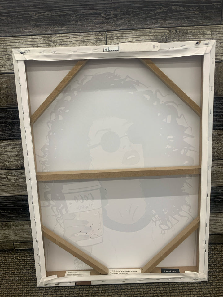 WOMAN HOLDING ESPRESSO CANVAS WALL ART.