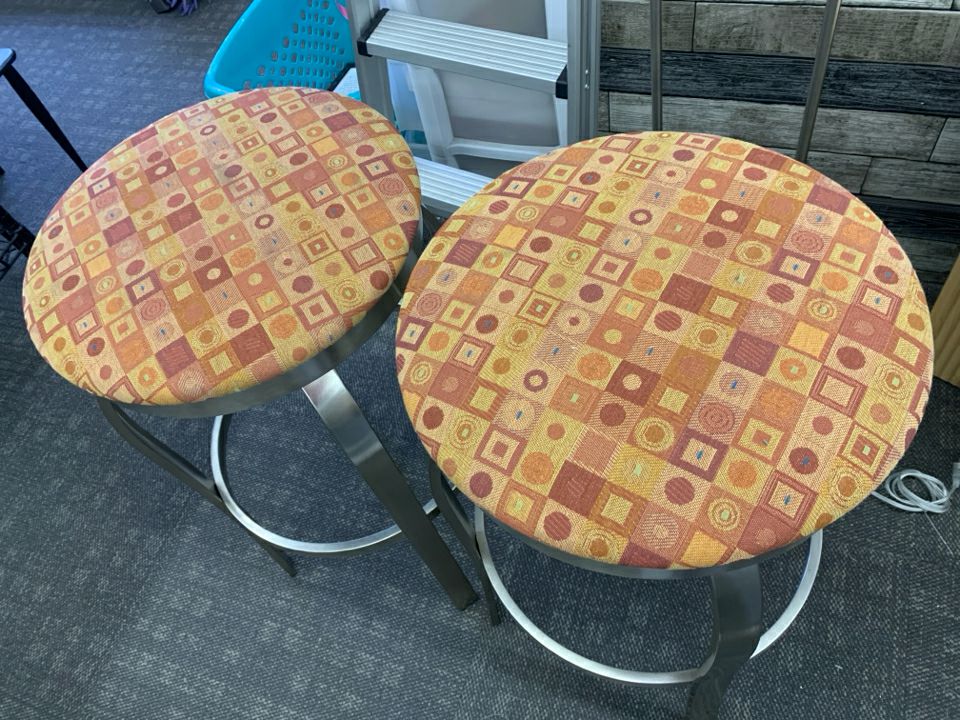 2 TALL SILVER LEG ORANGE CUSHION STOOLS.