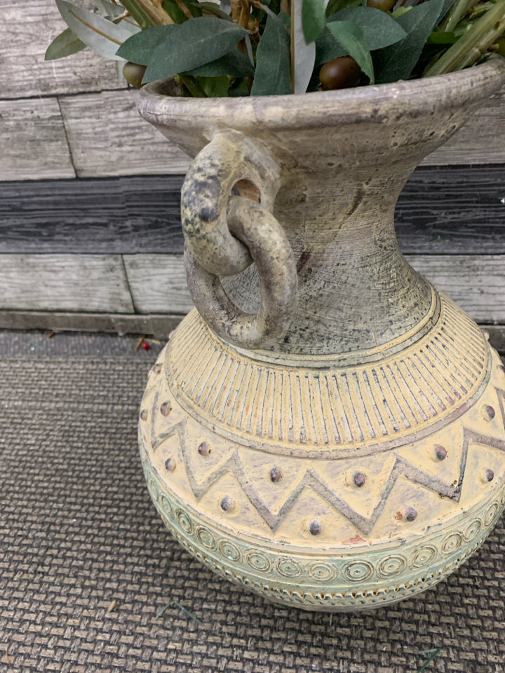 ORANGE AND YELLOW FLORAL IN CARVED POTTERY VASE.