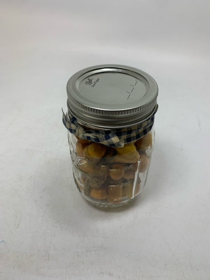BALL JAR FULL OF FAUX ACORNS.