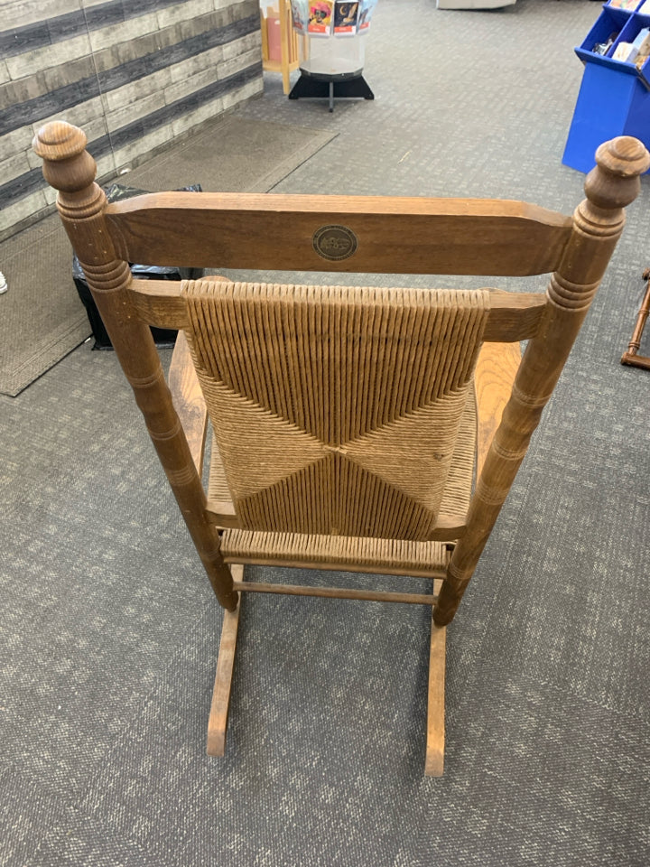 CRACKER BARREL WOVEN SEAT ROCKING CHAIR.