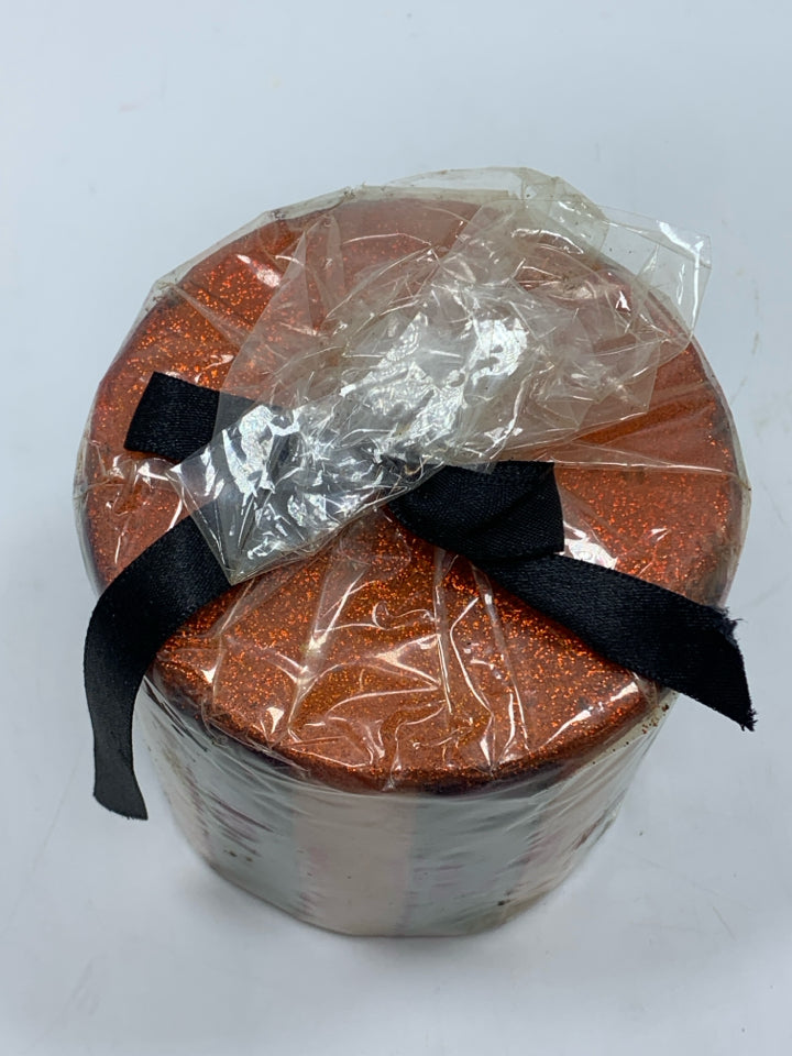 BLACK & ORANGE STRIPED CANDLE.