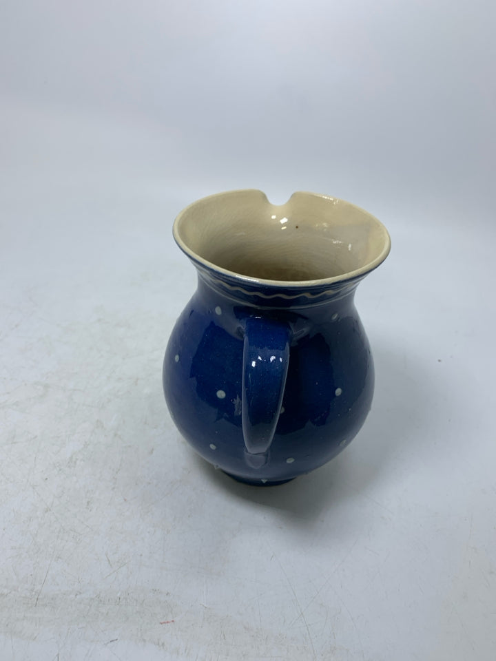 DARK BLUE CREAMER W/ PAINTED FLOWERS.