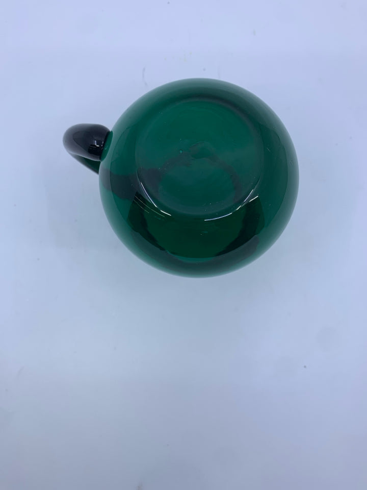 SMALL LIGHT GREEN GLASS PITCHER.