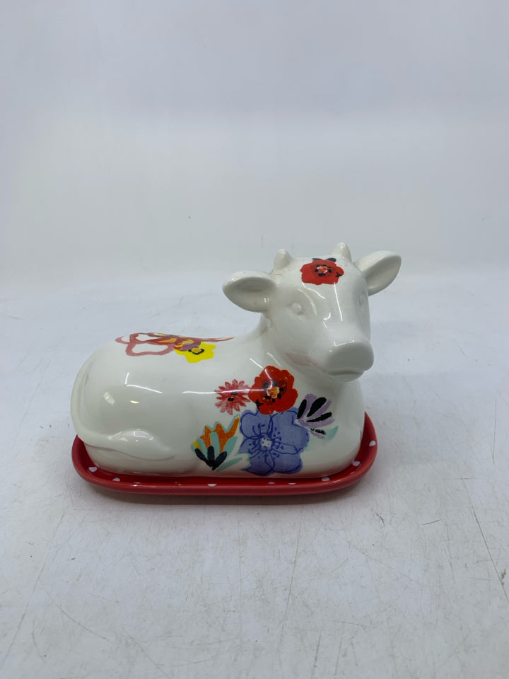 WHITE FLORAL COW SHAPED BUTTER DISH.