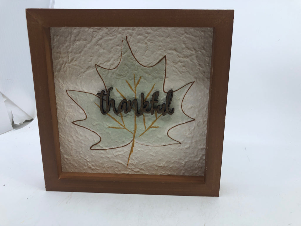 EMBOSSED THANKFUL SMALL WALL ART W/ TEAL LEAF BACKGROUND.