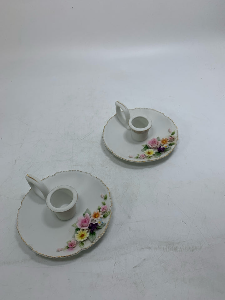 2 WHITE TAPER CANDLE HOLDERS W/ 3D ASSORTED FLOWERS GOLD DETAILS.
