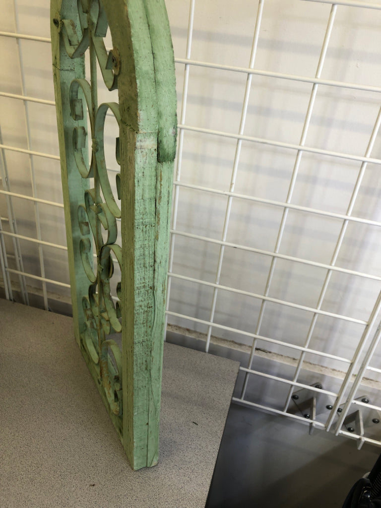 DISTRESSED GREEN PAINTED ARCH W/ METAL SCROLL WALL ART.