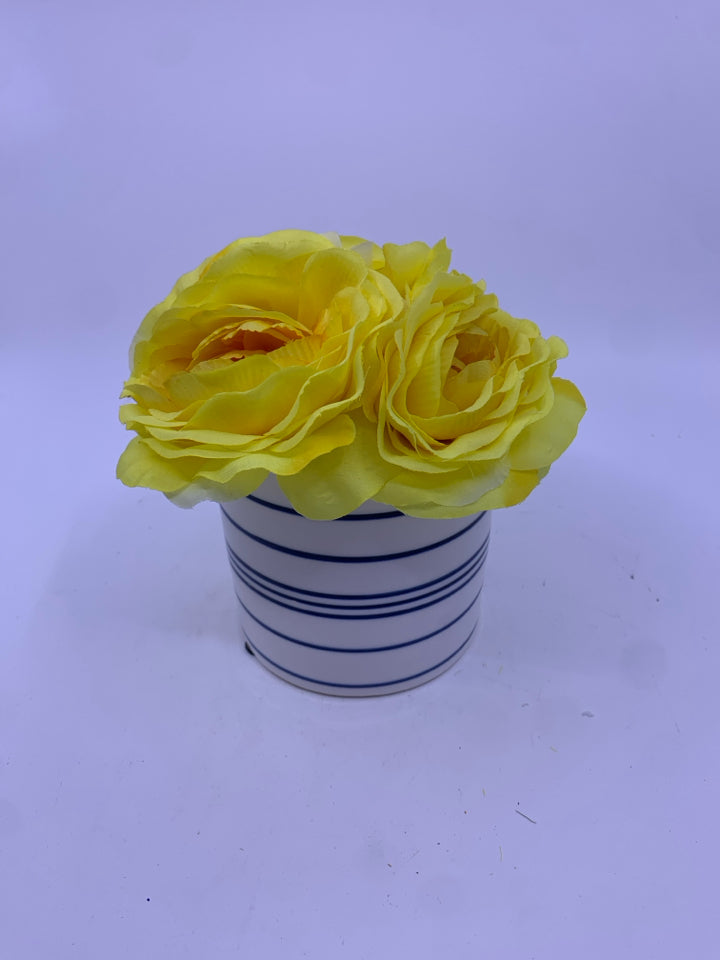 YELLOW FLORAL IN BLUE AND WHITE VASE.