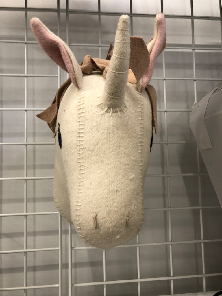 PLUSH UNICORN WALL HANGING.