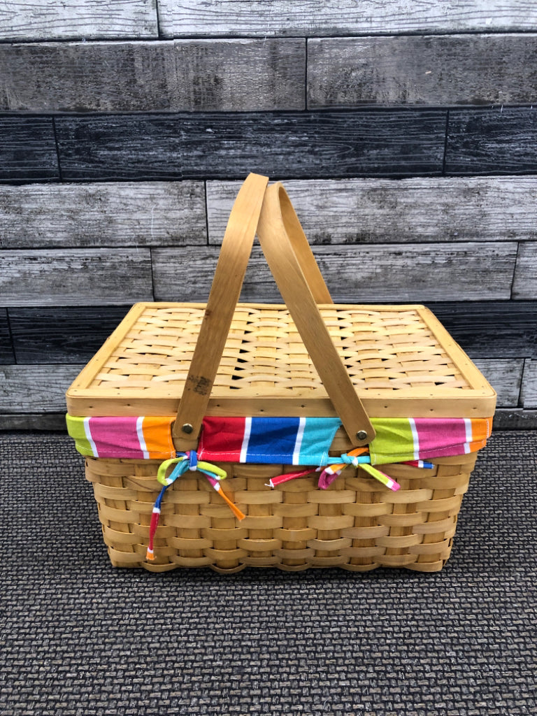 BLONDE WICKER BASKET WITH RAINBOW LINER WITH HANDLES.