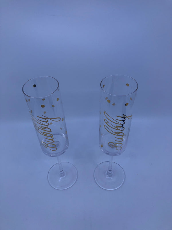 2 CHAMPAGNE FLUTES W/ BUBBLY IN GOLD W/ POLKA DOTS.