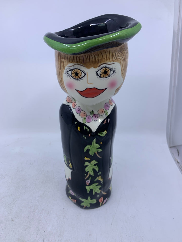 WOMAN SHAPED VASE W/ BLACK DRESS FLOWER NECKLACE.