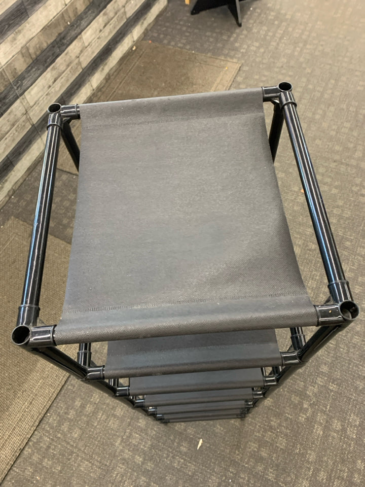 10 TIER VERTICAL PLASTIC/FABRIC SHOE RACK.