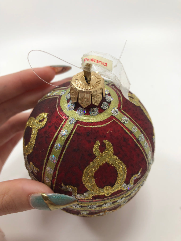 RED & GOLD EGG SHAPED ORNAMENT.