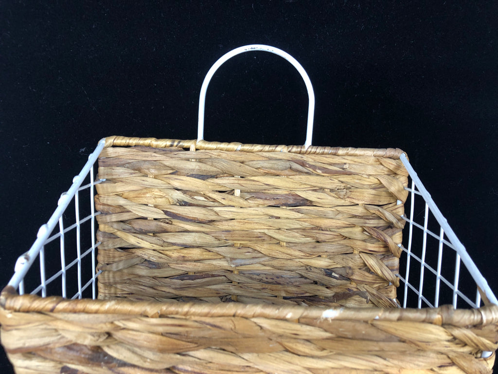 WICKER AND WHITE METAL WALL HANGING BASKET.