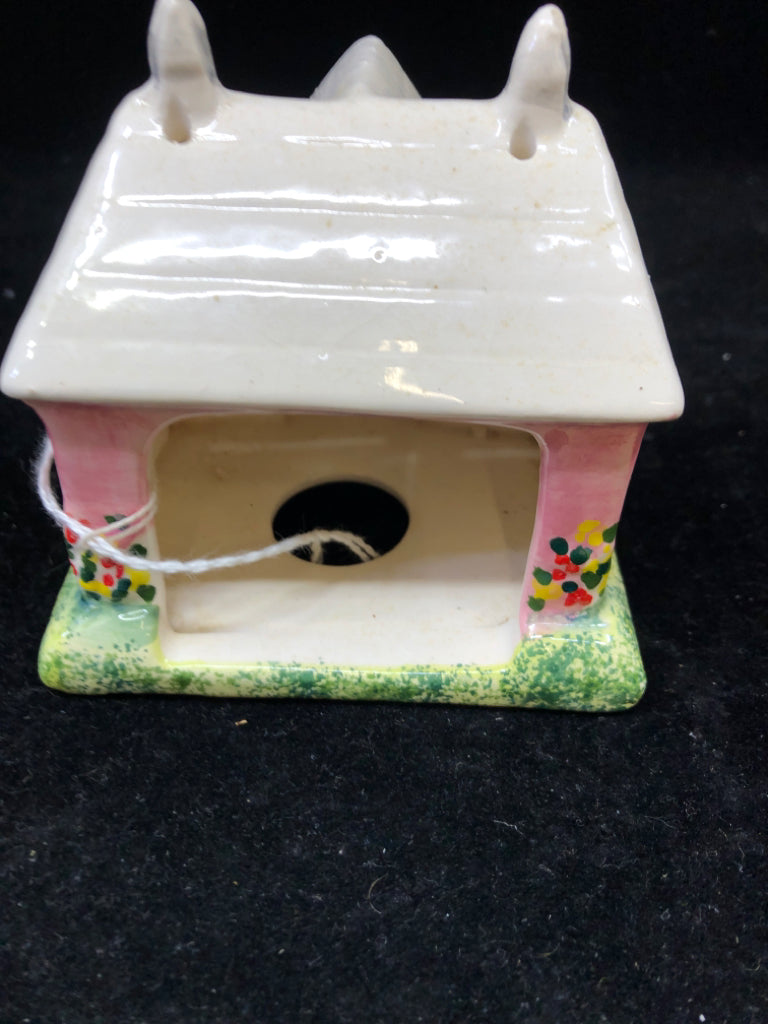 CERAMIC HOUSE TEALIGHT HOLDER.