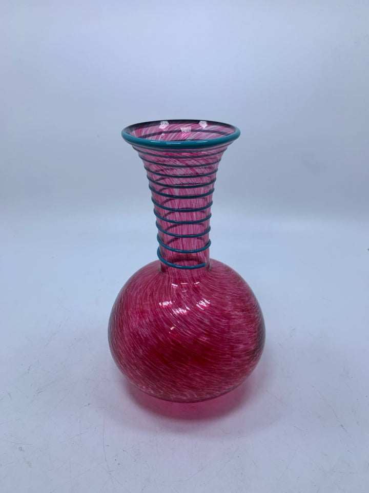PINK SPECKLED BLOWN GLASS VASE W/ EMBOSSED BLUE SWIRL ON NECK.