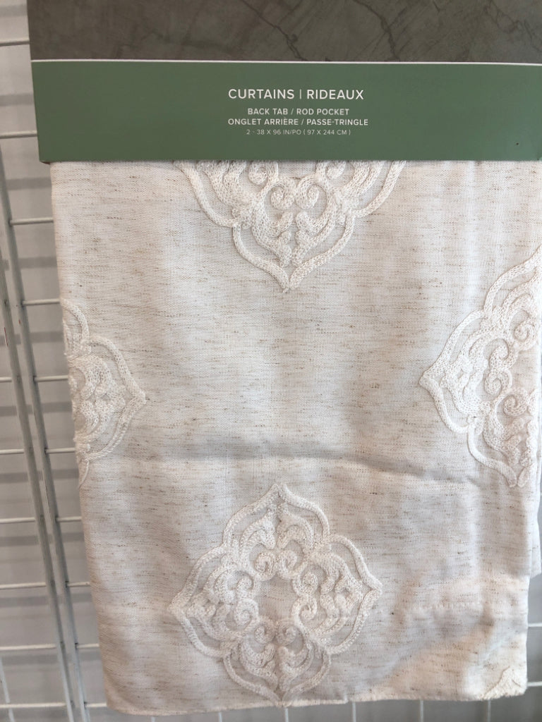 NIP 2PK CREAM BACK TAB CURTAINS.