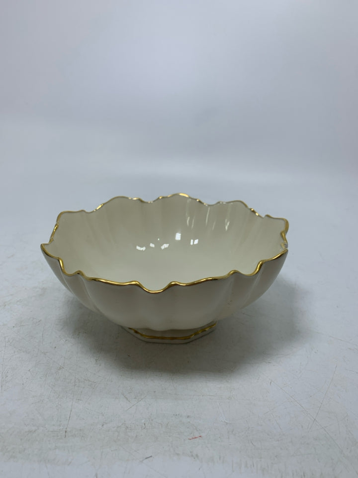 FOOTED CANDY DISH W/ UNEVEN GOLD EDGE.