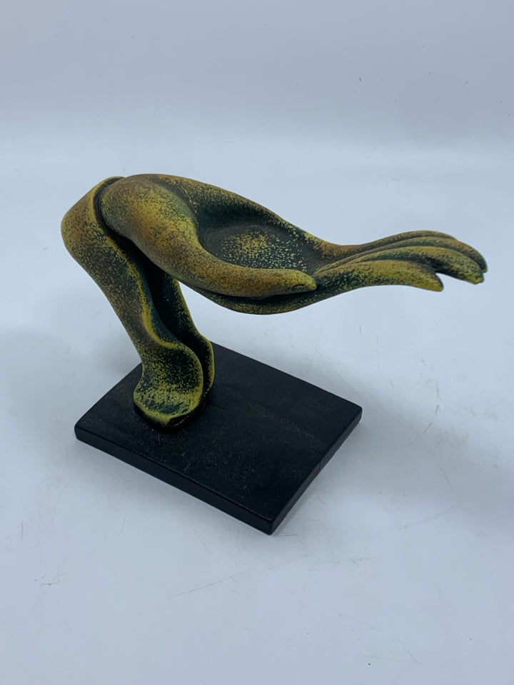 DISTRESSED GREEN AND GOLD HAND SCULPTURE ON BLACK BASE.