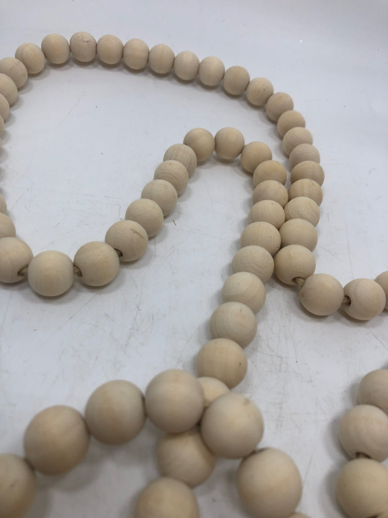 WOOD BEAD GARLAND W/TASSELS.
