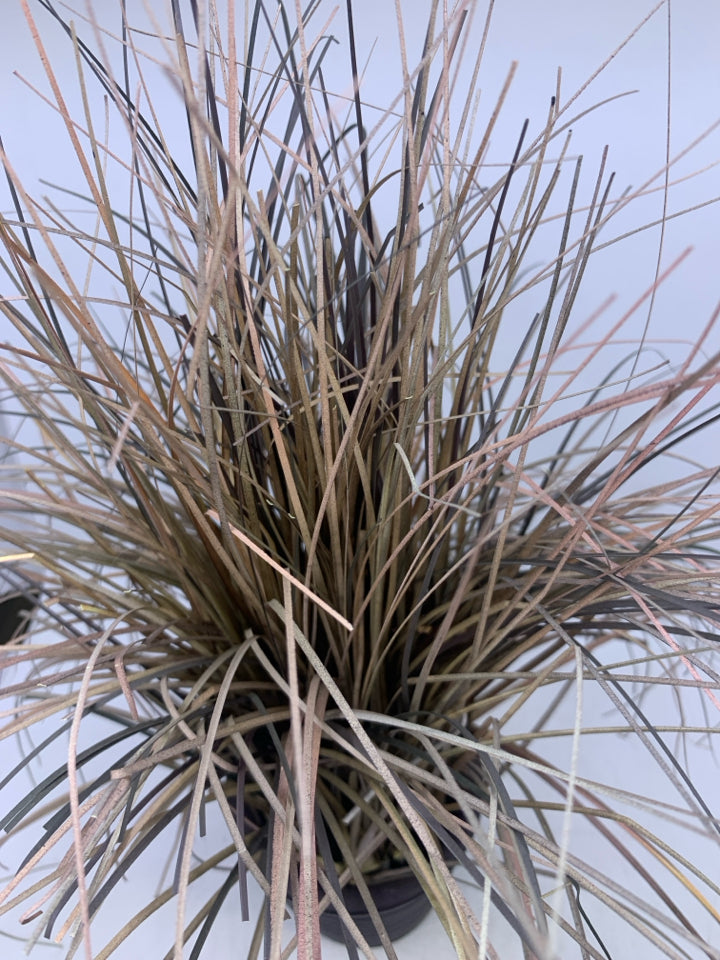 FAUX DRIED GRASS IN RED BROWN PLANTER.