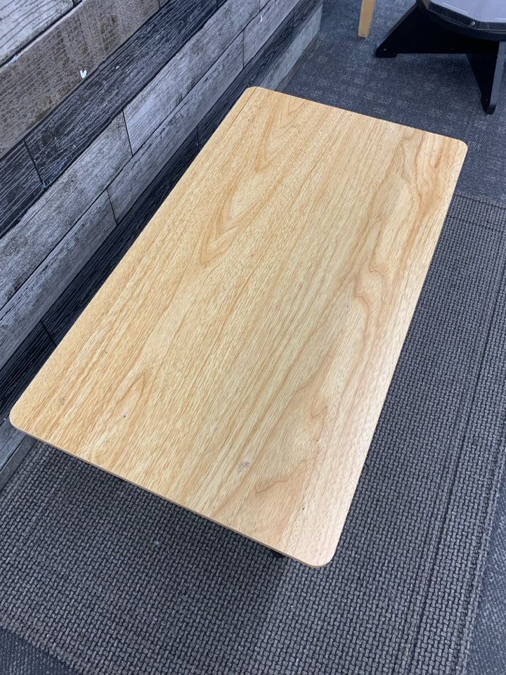 SMALL WOOD TABLE W/BLACK LEGS.