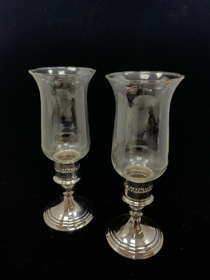 2 GLASS CANDLE HOLDERS W/SILVER BASE.
