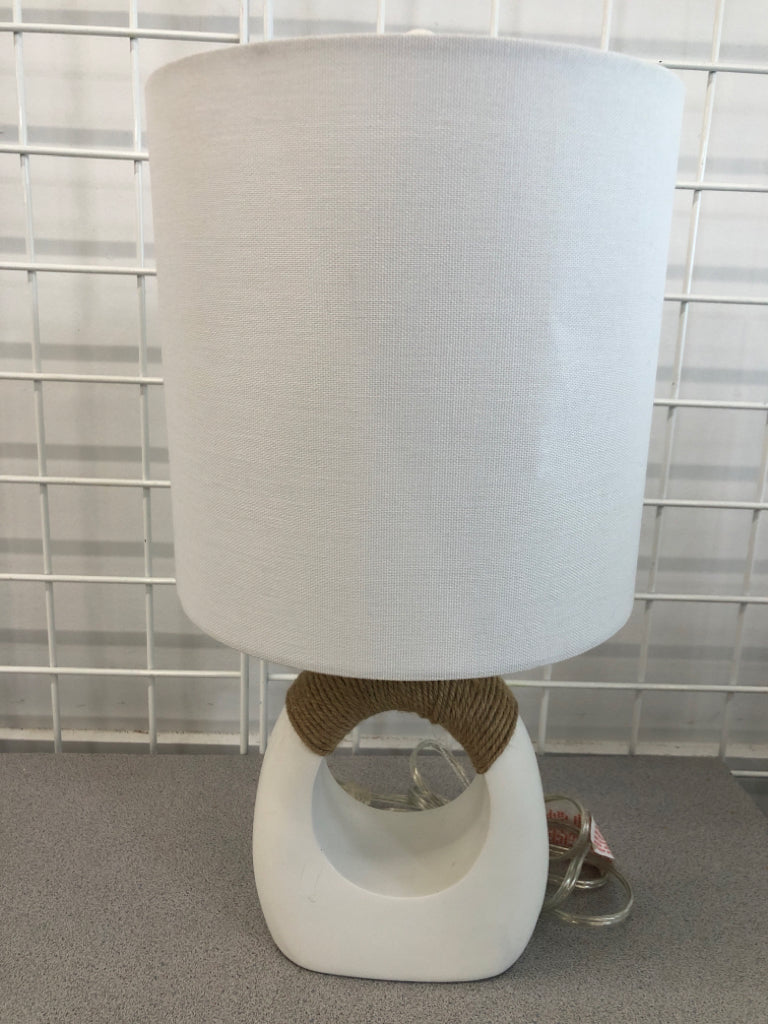 LAMP W/ WHITE SHADE AND ABSTRACT TWINE BASE.