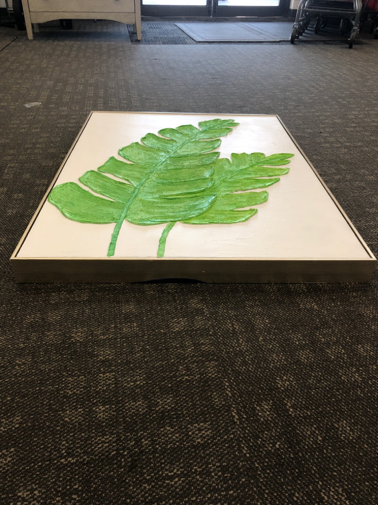 GREEN LEAF TEXTURED PAINT CANVAS IN GOLD FRAME.