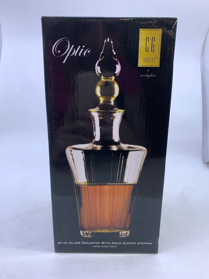 NIB GLASS DECANTER WITH GOLD ACCENTS STOPPER.