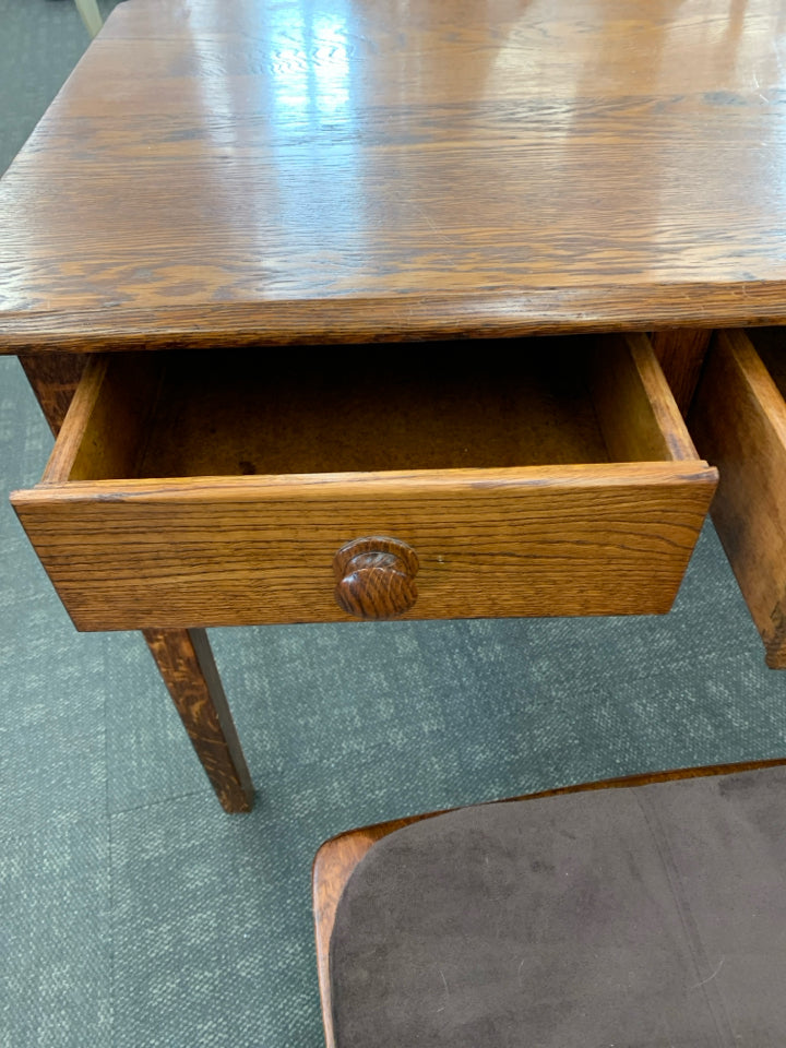HEAVY WOOD DESK W/2 DRAWERS & CHAIR W/BROWN CUSHION.