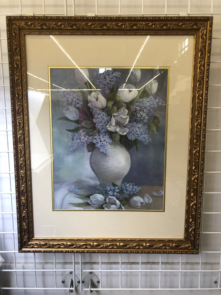 BLUE AND WHITE FLORAL IN GOLD ORNATE FRAME.
