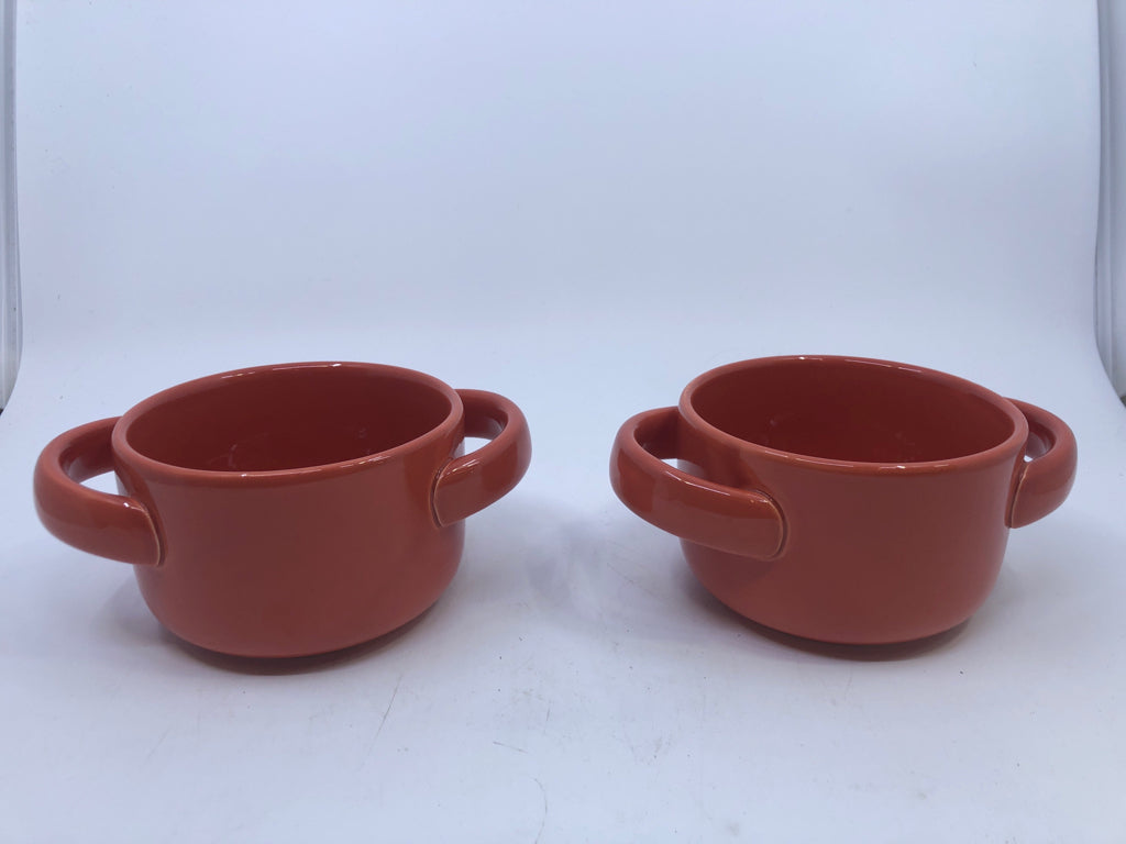 2 ORANGE BAKERS W HANDLES.