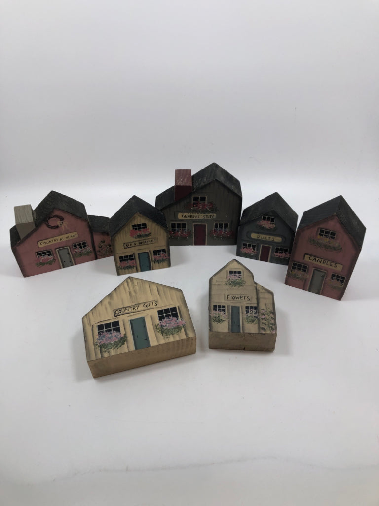7 WOOD PAINTED BLOCK HOUSES IN BAG.