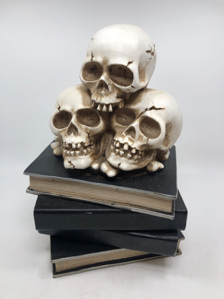 SKULLS ON BOOK STACK RESIN FIGURE.