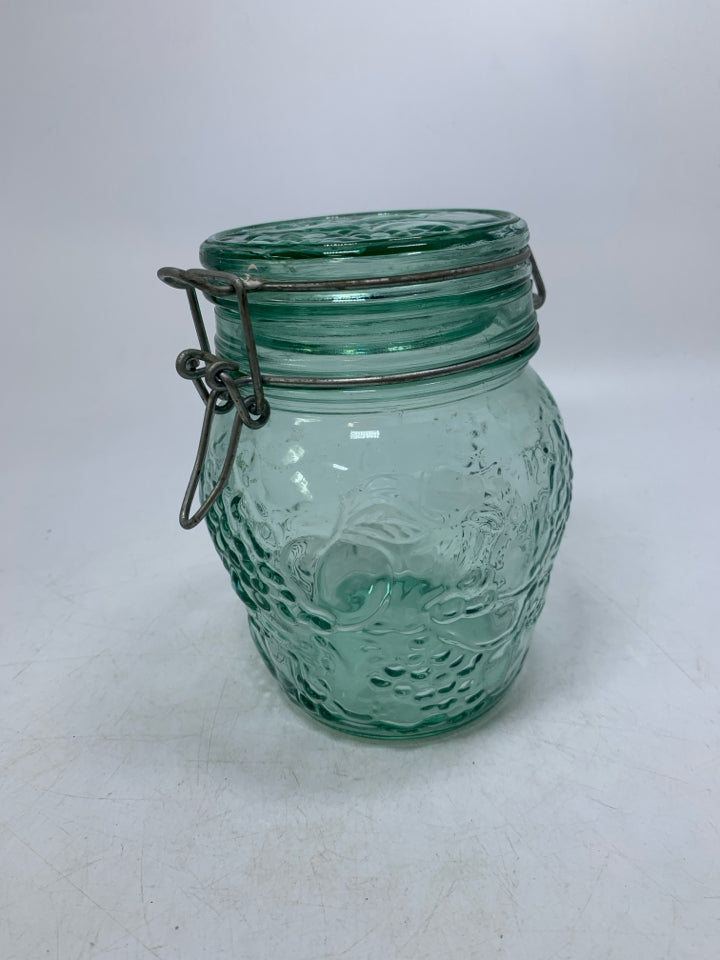 GREEN TINTED GLASS EMBOSSED FRUIT CANISTER.