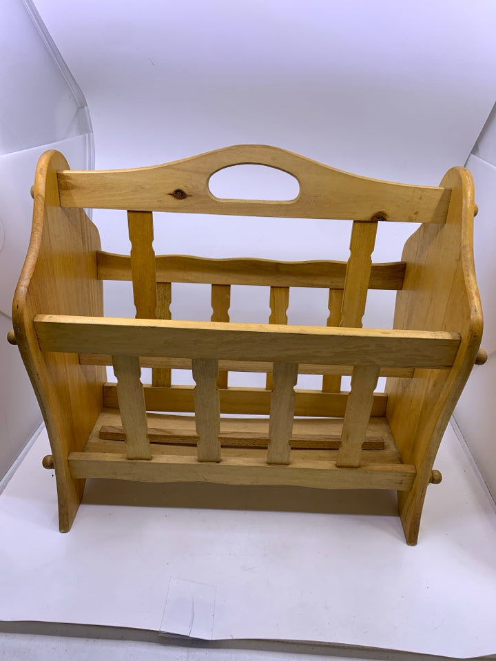 BLONDE FOOTED MAGAZINE RACK.