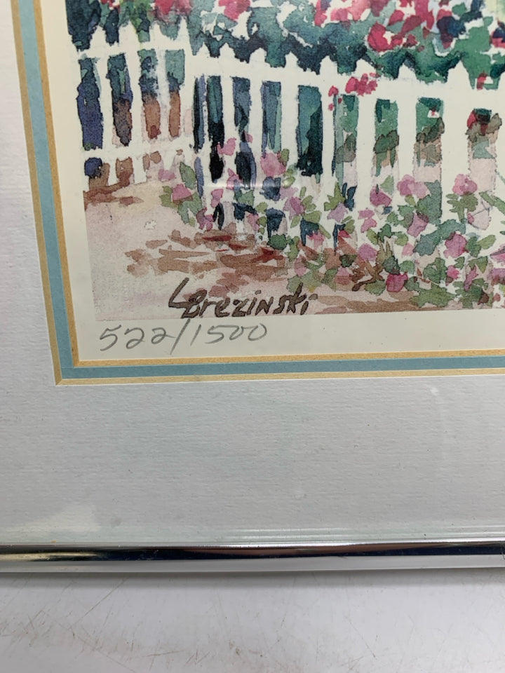 COTTAGE SCENE W/ RED FLOWERS FENCE WATERCOLOR SIGNED BY ARTIST SILVER FRAME.