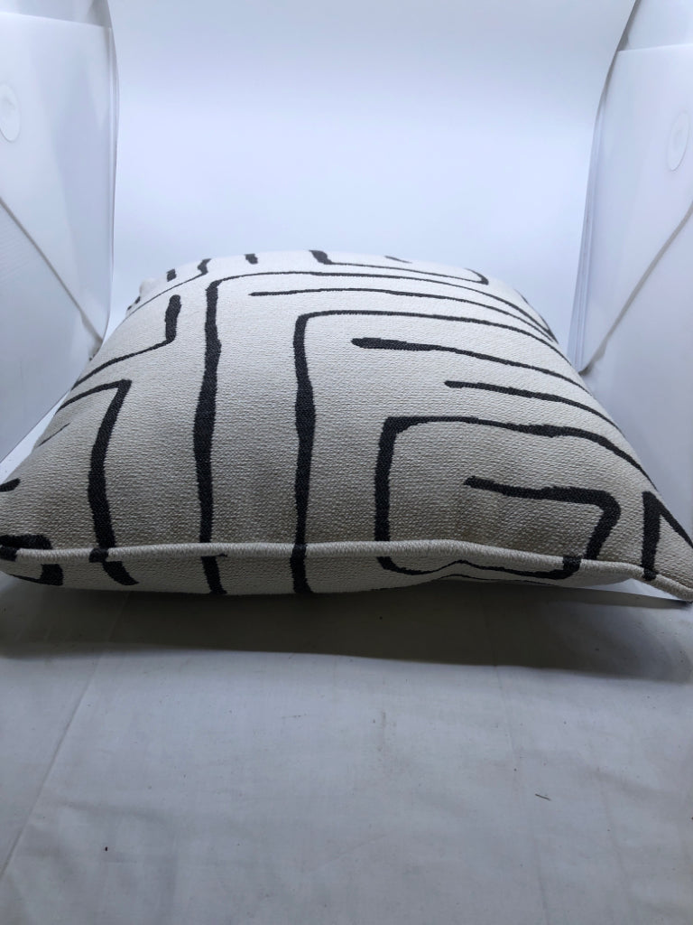 WHITE ACCENT PILLOW WITH BLACK SWIRL.