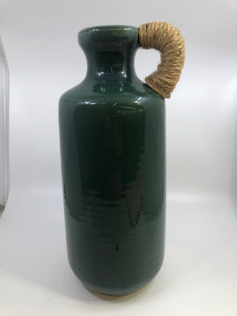 GREEN CERAMIC VASE WITH TWINE WRAPPED HANDLE.