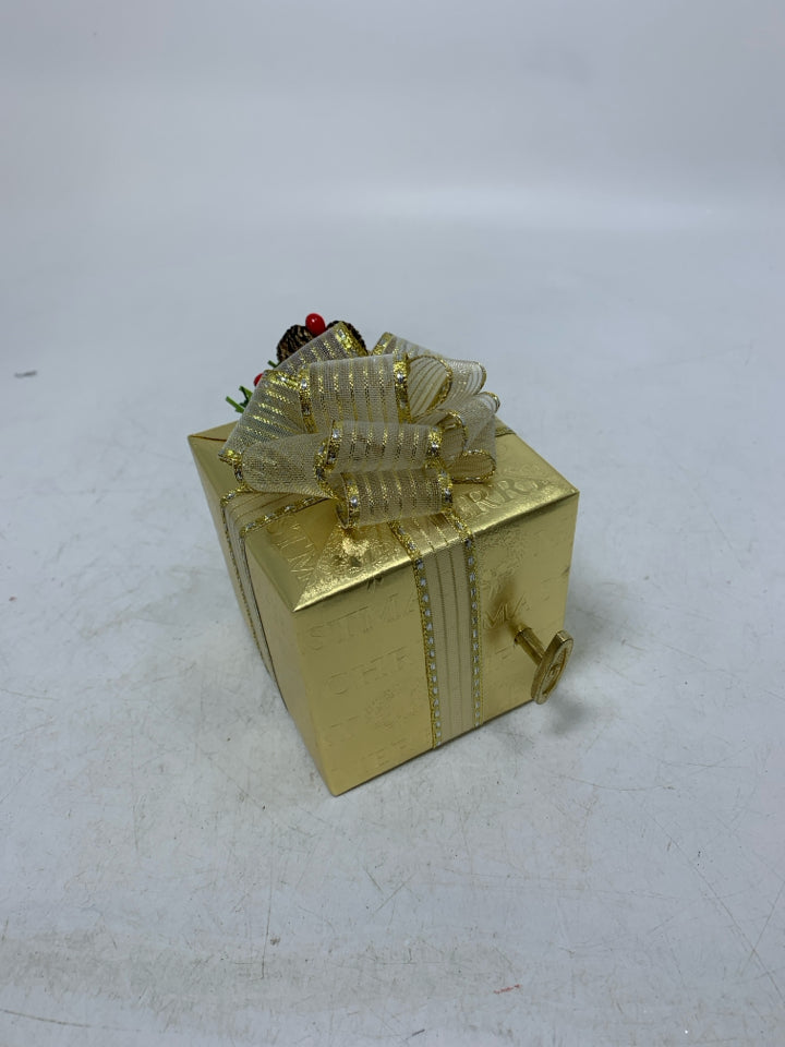 GOLD WRAPPED PRESENT "LET IT SNOW" MUSIC BOX.